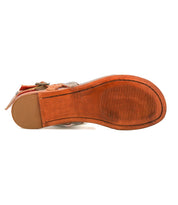 The Moon sandal by Bed|Stü is a brown leather style, shown here from the bottom to highlight its textured rubber sole with horizontal grooves and a smooth heel area. It features an ankle buckle and a cushioned insole for enhanced comfort.