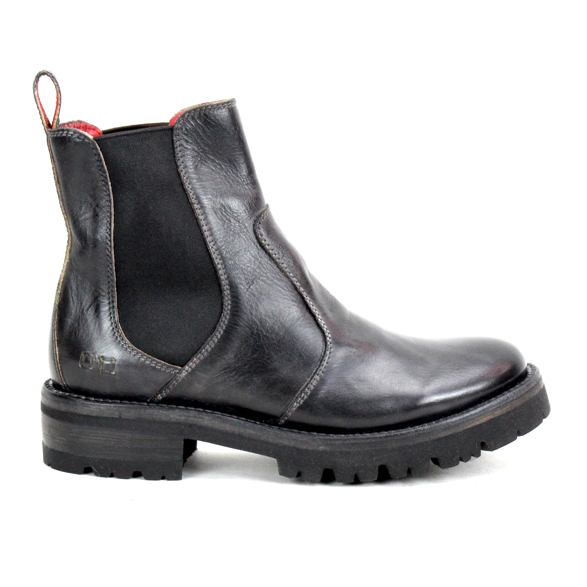 The Bed|Stü Nandi III is a black leather Chelsea boot featuring dual side gores, a heel pull tab, and a thick ridged rubber sole, shown in profile for a timeless look.