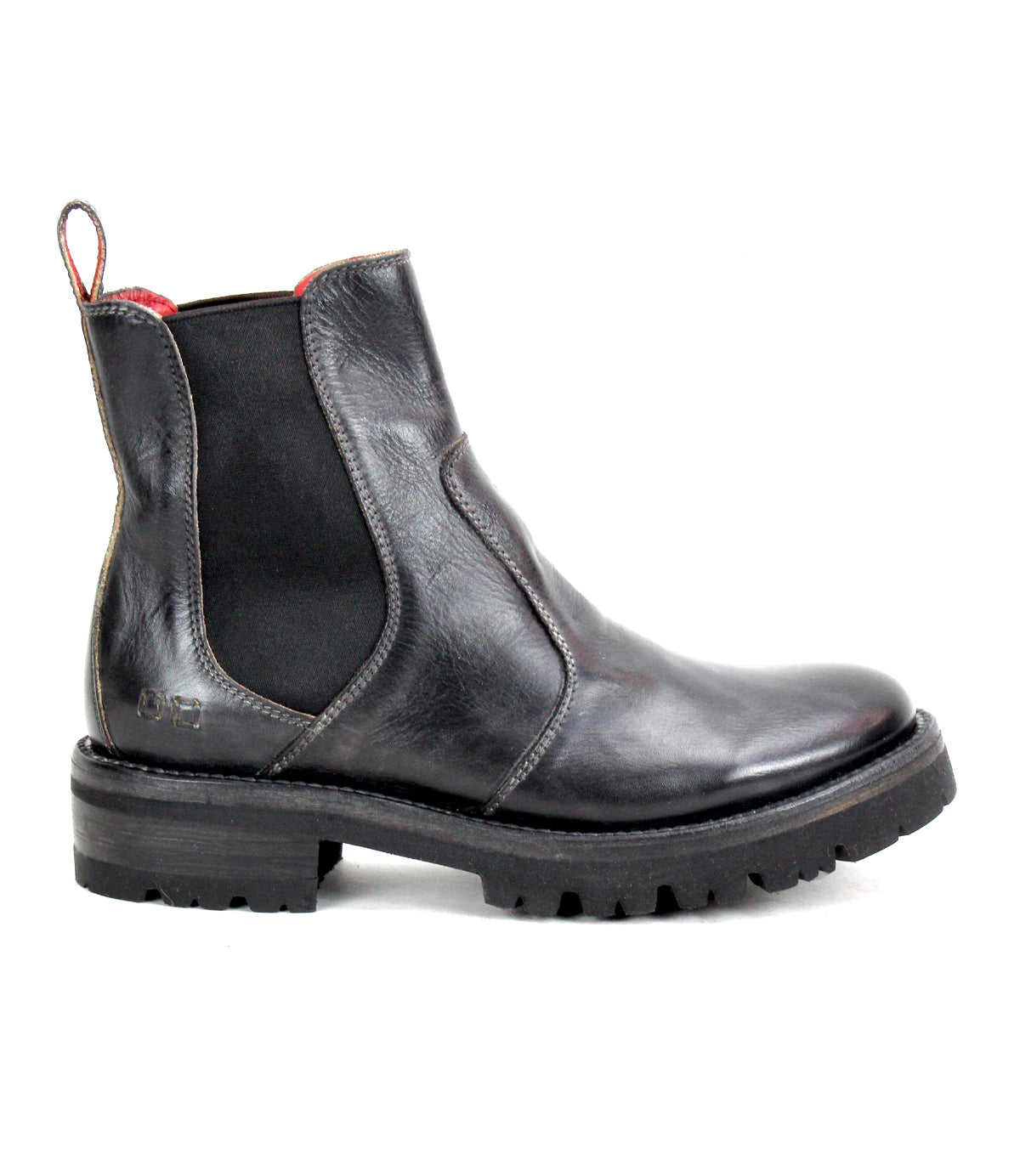 The Bed|Stü Nandi III is a black leather Chelsea boot featuring dual side gores, a heel pull tab, and a thick ridged rubber sole, shown in profile for a timeless look.