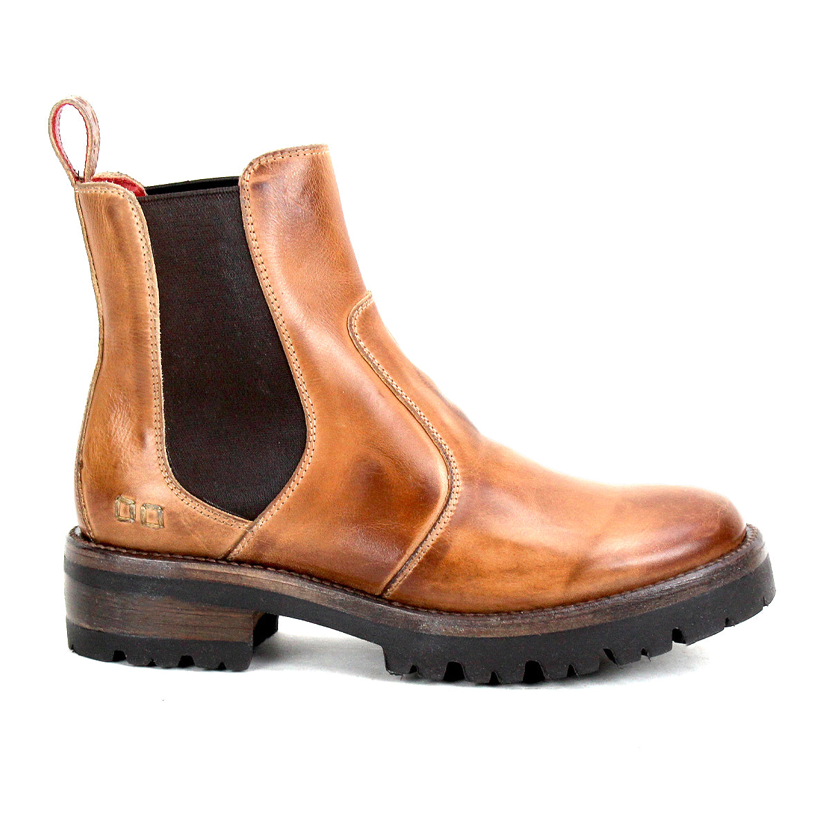 The Bed|Stü Nandi III is a brown leather Chelsea boot featuring dual black elastic side panels, a convenient heel pull tab, and a thick black rubber sole. Shown in profile against a white background, it offers a timeless silhouette.