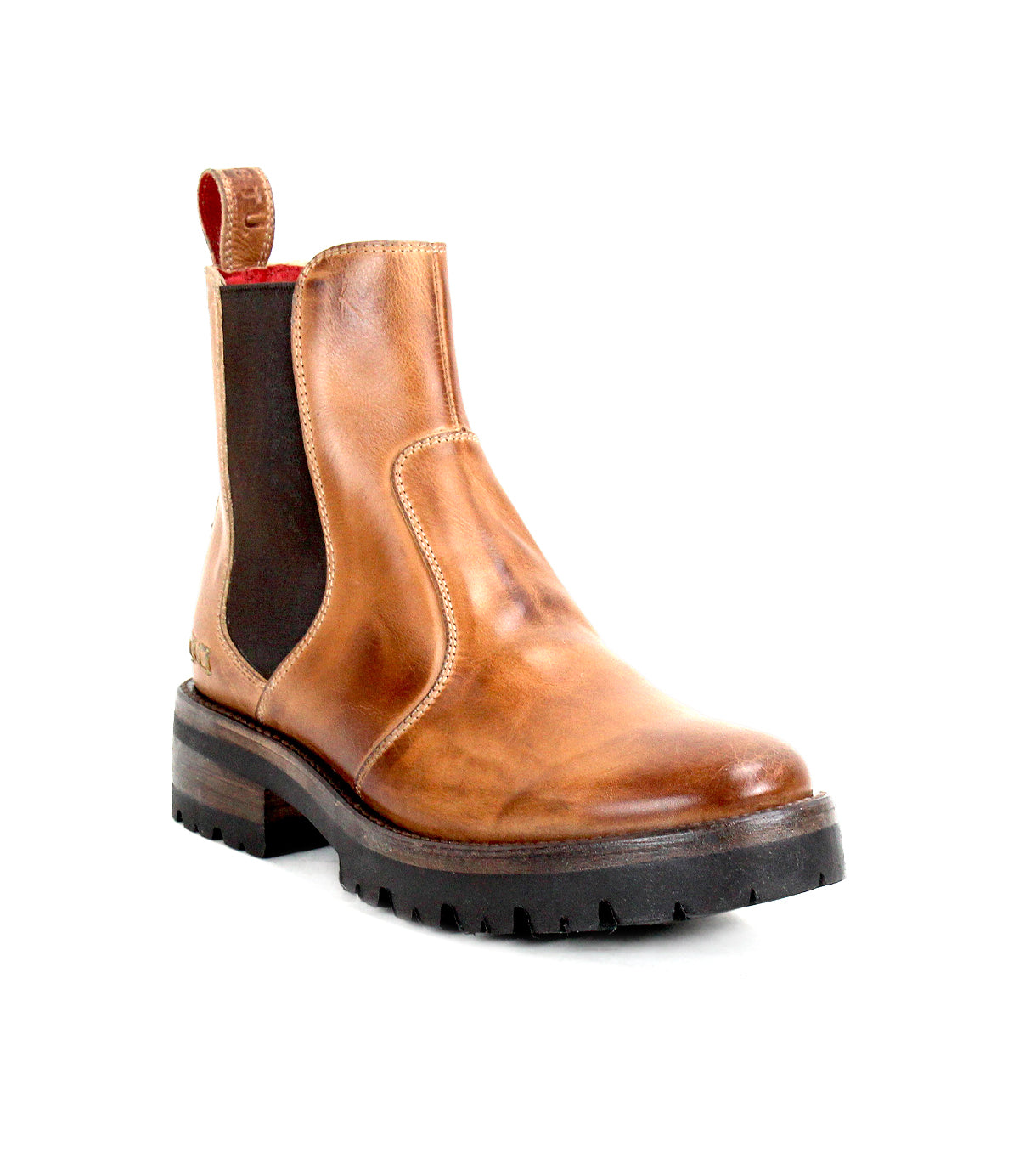 Nandi III by Bed|Stü—a brown leather Chelsea boot featuring dual side gores, black elastic panels, a red pull tab, and a thick black treaded sole—timelessly displayed on a white background.