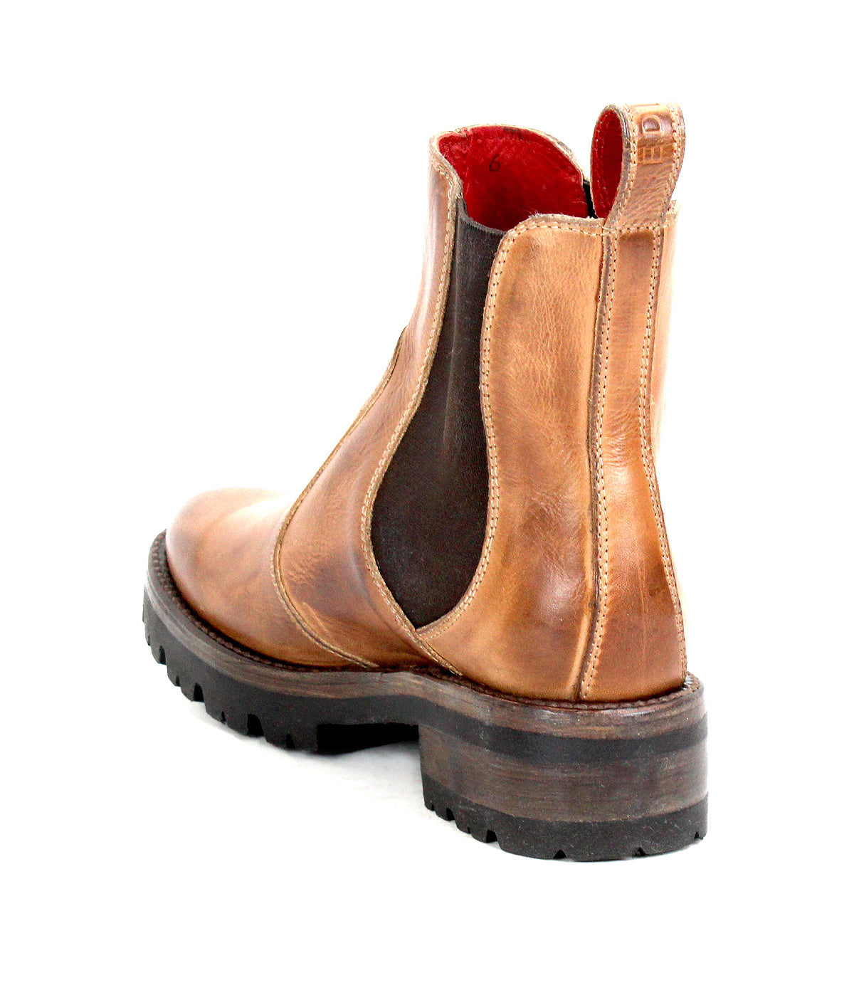 Bed|Stü's Nandi III is a brown leather Chelsea boot featuring dual side gores with black elastic panels, a thick treaded sole, and a bold red interior lining, pictured from a rear side angle for an effortlessly timeless look.