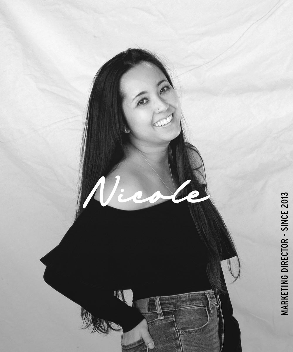 Black-and-white portrait of a smiling woman with the name “Nicole” overlaid and vertical text reading “Marketing Director · Since 2013.”
