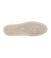The image shows the tread pattern on the white rubber sole of Bed|Stü's North, a classic men's footwear staple, featuring zigzag lines and circular designs.