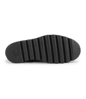 The image displays the bottom view of the Bed|Stü Novel II Chelsea boot sole in black, featuring deep, evenly spaced horizontal grooves running along its length.