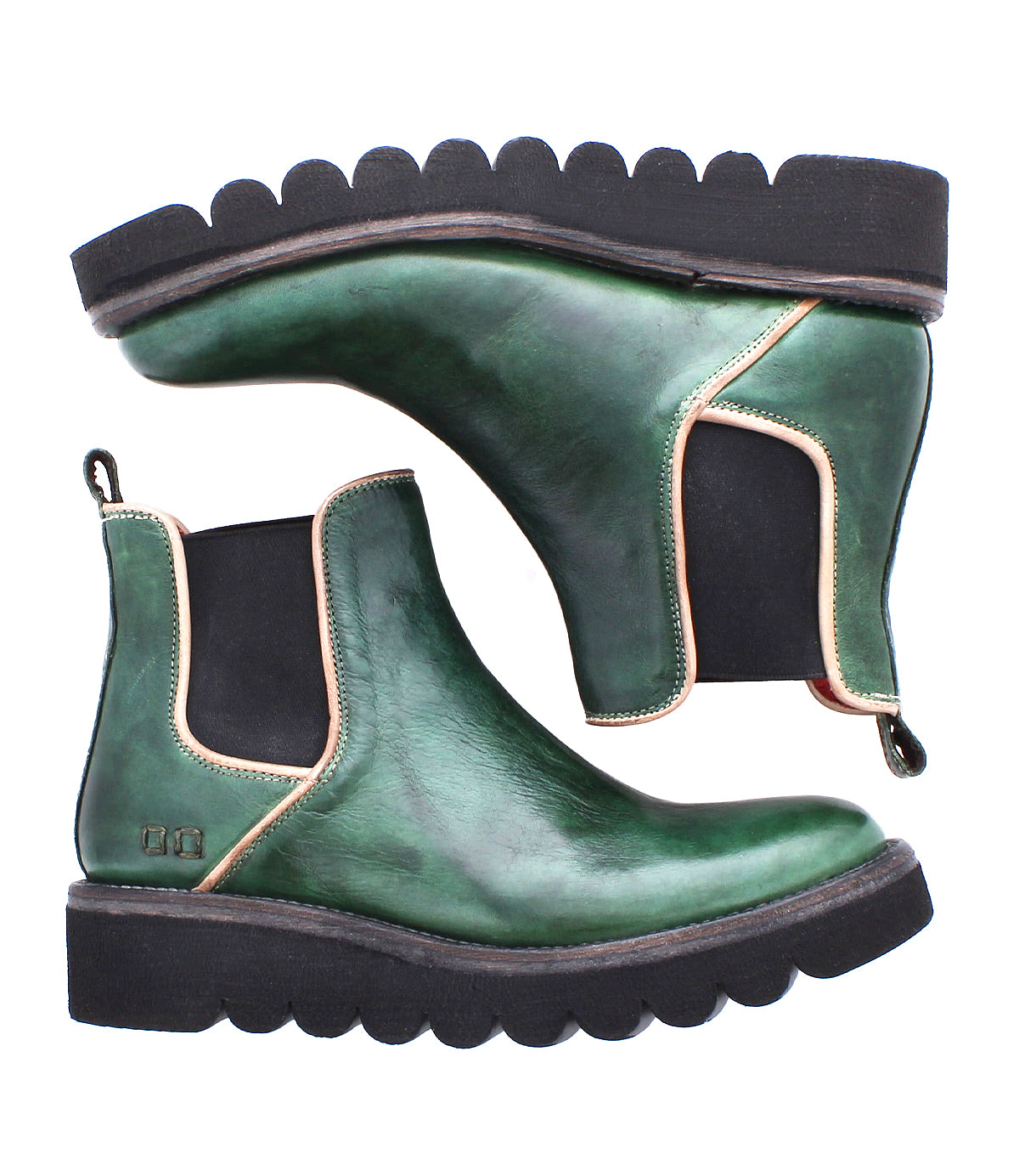A pair of Bed|Stü Novel II green leather Chelsea boots, featuring a smooth leather upper, black elastic sides, and a thick, black scalloped platform sole, are positioned side by side—one upright and one on its side.