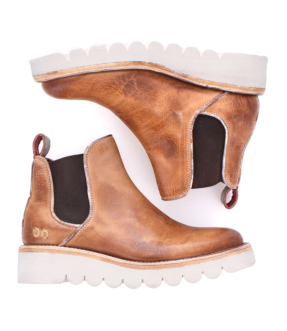 Pair of tan Bed|Stü Novel II Chelsea boots featuring a leather upper, white scalloped platform sole, brown elastic side panels, and pull tabs, displayed on a white background.