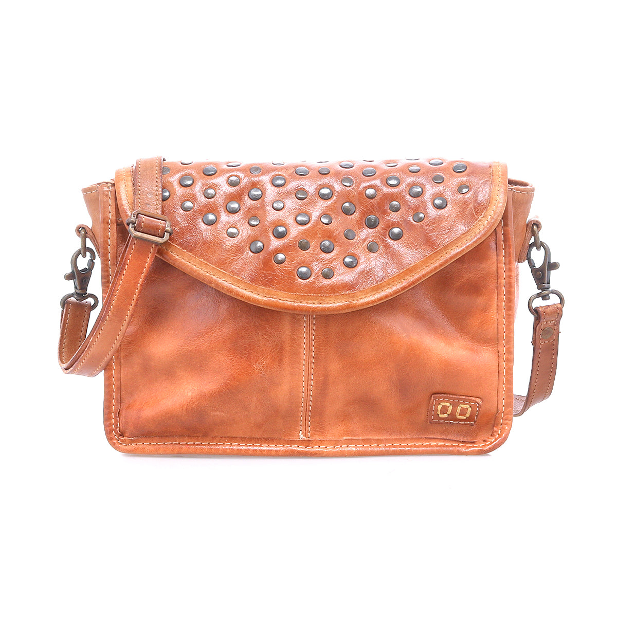 Introducing the Occurrence by Bed|Stü: a brown leather crossbody bag featuring a flap closure adorned with metal studs and an adjustable strap. Photographed on a white background, this compact accessory is perfect for elevating your everyday style.