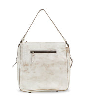 Bed|Stü's Packet LTC is a beige leather tote featuring a top handle, zippered front pocket, and subtle worn texture, displayed against a white background; this versatile travel bag seamlessly blends style and functionality for your journeys.