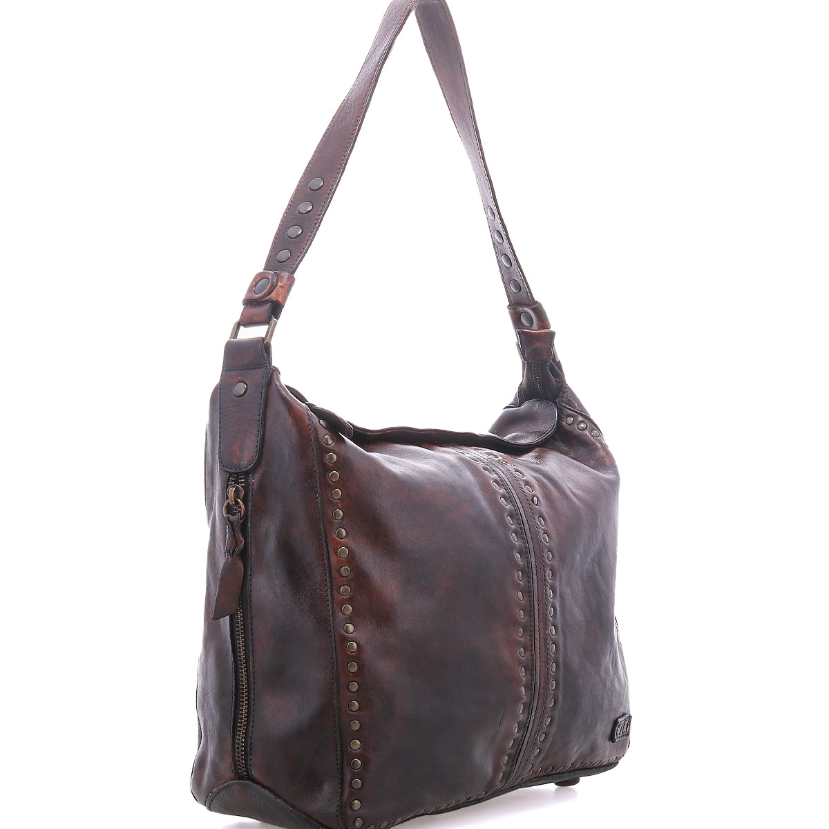 Packet LTC by Bed|Stü is a brown leather shoulder tote bag featuring a single strap, decorative metal studs, and a front zipper pocket, displayed against a white background.