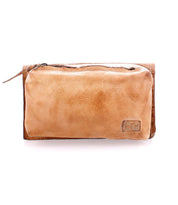 The Parle bag by Bed|Stü is a light brown soft leather accessory featuring a zippered front pocket and visible stitching, displayed against a plain white background.