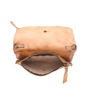 Introducing Parle by Bed|Stü: a tan soft leather crossbody bag featuring a flap opening that reveals zippered compartments inside and detailed visible stitching along the edges. Designed with an adjustable strap for comfortable, hands-free wear.