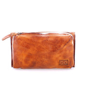 Bed|Stü's Parle brown leather wallet features zippered compartments and a small stitched logo patch, shown against a plain white background.