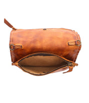 Bed|Stü’s Parle bag in brown soft leather is shown open against a white background, revealing its empty suede-lined main compartment and visible zipper. The Parle design includes zippered compartments for added organization.