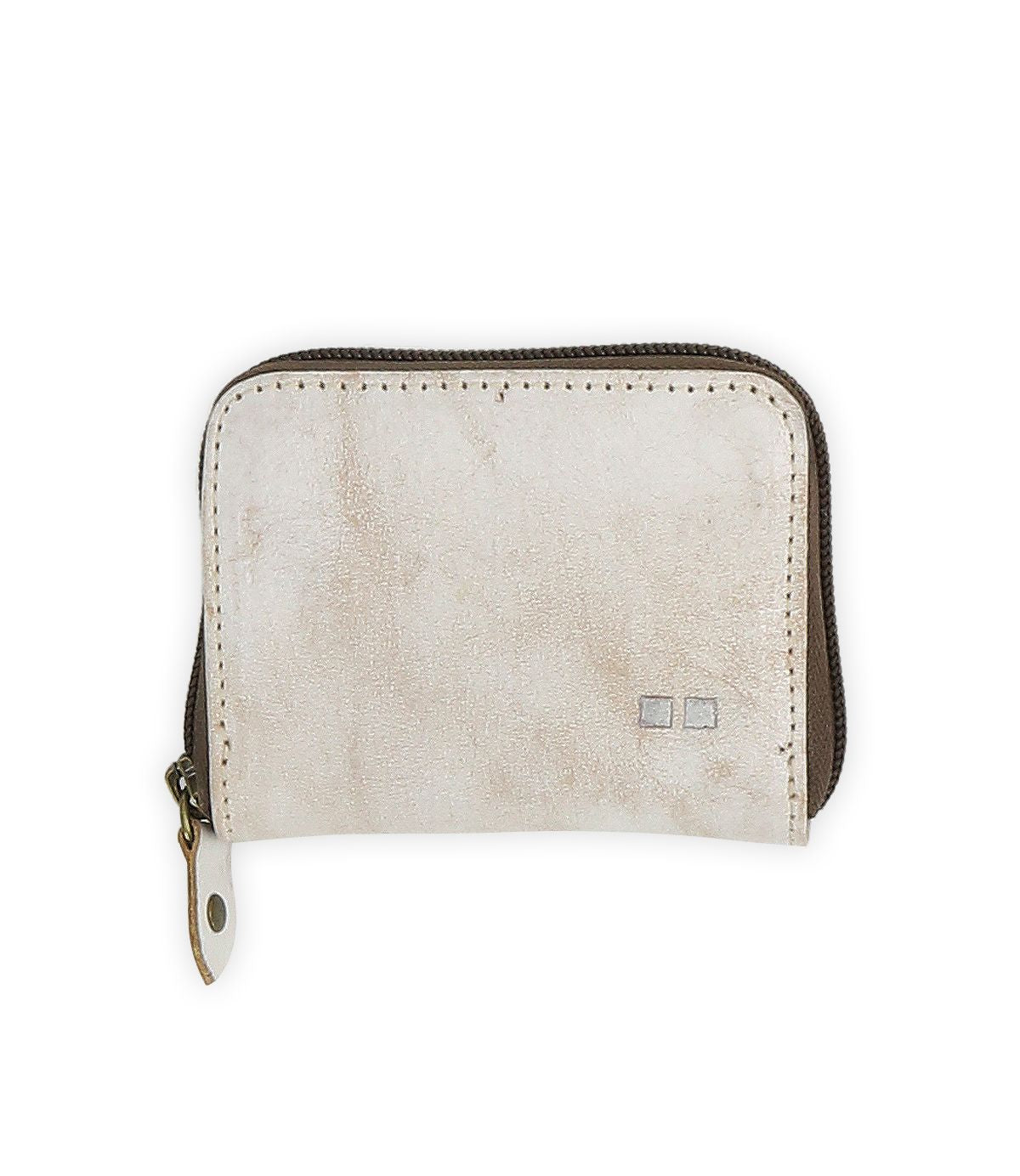 The Peek wallet by Bed|Stü is a small, rectangular beige zippered accessory crafted from premium leather, featuring a metal pull tab and two small square accents on the front. Inside, accordion card slots provide organized and convenient storage.