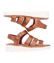 A pair of Bed|Stü Perfect brown leather fisherman sandals featuring thick white platform soles and silver buckles, positioned side by side against a white background.
