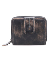 The Bed|Stü Plus wallet is a compact leather accessory available in black and brown, showcasing a bifold design with a secure zipper closure, a zippered coin pocket, and a front snap tab, all displayed against a white background.
