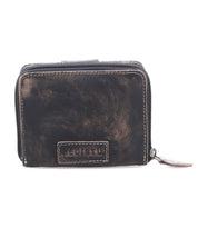 A small, distressed brown compact leather wallet by Bed|Stü, the Plus, featuring a zipper closure and a stitched label on the front that reads "BEDISTU." This stylish bifold wallet also includes a zippered coin pocket for added convenience.