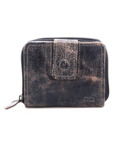Bed|Stü Plus compact leather wallet in dark brown, featuring a front flap and zippered coin pocket; shows significant wear with creasing.