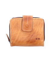 The Bed|Stü Plus is a compact tan leather wallet featuring visible stitching, a snap closure, and a convenient zippered coin pocket, shown against a white background.
