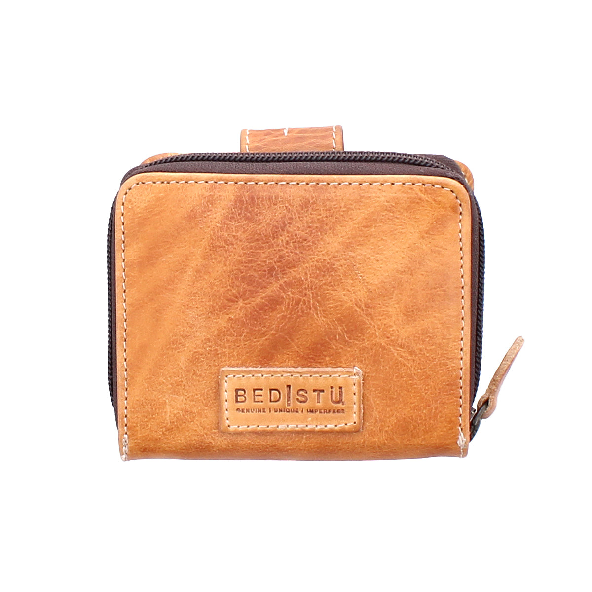 Compact brown leather wallet called "Plus" by Bed|Stü, featuring a zipper closure, front BED|STÜ logo patch, and a convenient zippered coin pocket, displayed against a white background.