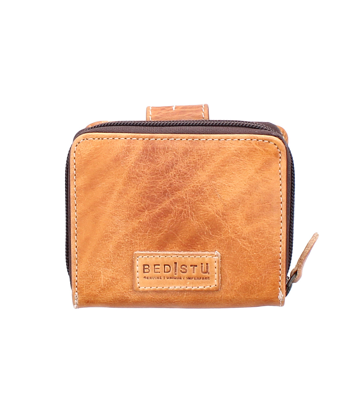 Compact brown leather wallet called "Plus" by Bed|Stü, featuring a zipper closure, front BED|STÜ logo patch, and a convenient zippered coin pocket, displayed against a white background.