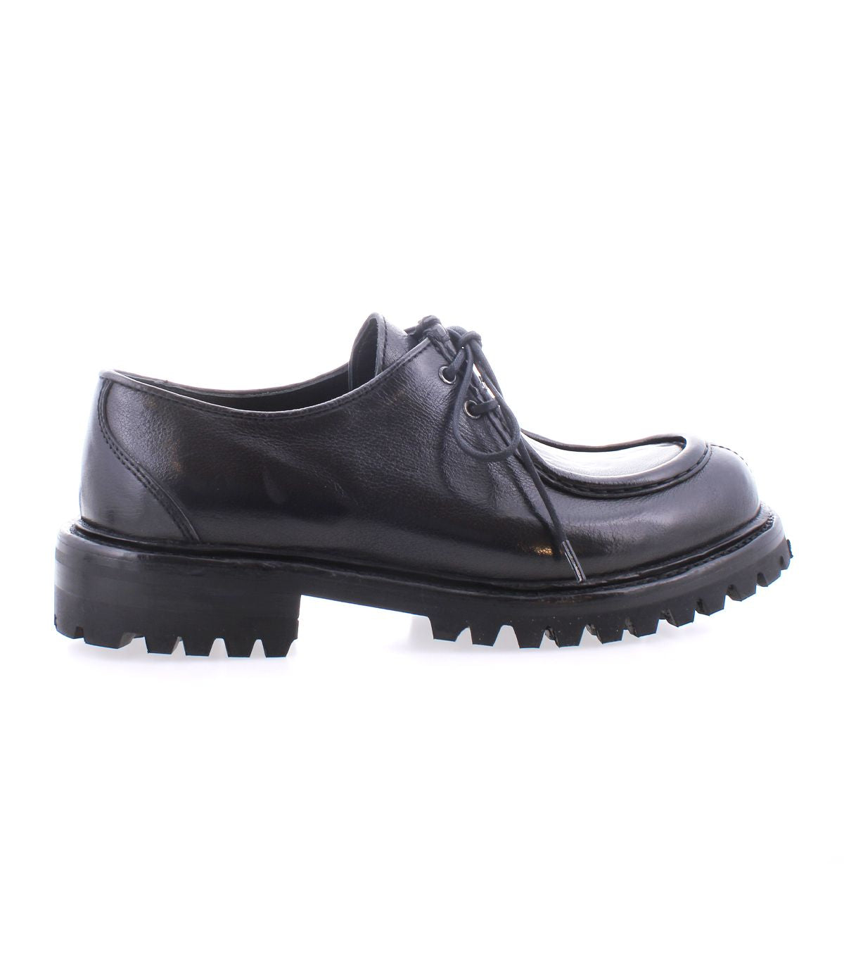 The Portare by Bed|Stü is a black leather lace-up dress shoe, shown in profile against a white background, featuring a chunky, ridged rubber sole and subtle moc-toe detailing reminiscent of vintage-inspired boots.