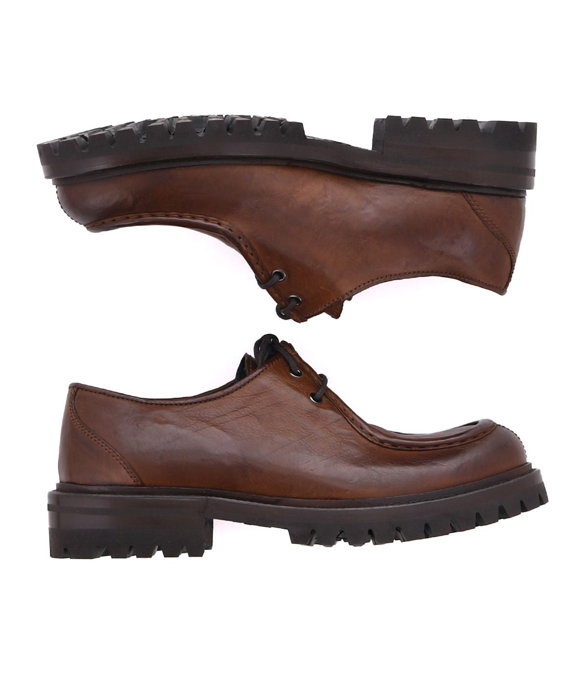 Two Portare boots by Bed|Stü, crafted from brown leather with moc-toe detailing, lace-up fronts, and thick black soles, are positioned sole-to-sole and toe-to-heel against a white background.