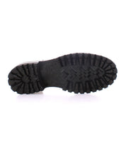 The image shows the black rubber sole of the Bed|Stü Portare moc-toe lace-up boot with a rugged tread pattern, viewed from the bottom against a white background.