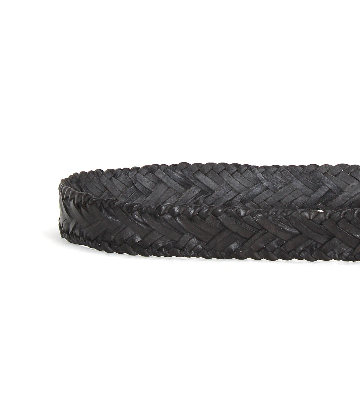 The Bed|Stü Proem belt, a black handwoven leather accessory with artisan detailing, is coiled on a white background.