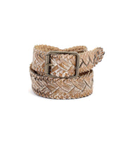 The Proem by Bed|Stü is a beige handwoven leather belt featuring artisan detailing and a vintage metal buckle, coiled neatly on a white background.
