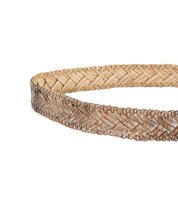 Close-up of the Bed|Stü Proem, a light brown handwoven leather belt featuring an intricate herringbone pattern and artisan craftsmanship, complemented by a vintage metal buckle, displayed against a white background.