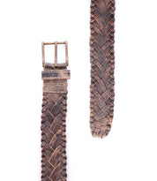 The Proem belt by Bed|Stü is shown on a white background, featuring brown handwoven leather with artisan detailing and a vintage metal buckle.