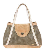 Introducing Proper by Bed|Stü: a spacious tote handbag crafted from large panels of vegetable-tanned leather in tan and olive hues. It features handwoven cream handles, a front flap with a clasp closure, and an organic cotton-lined interior for a refined finish.