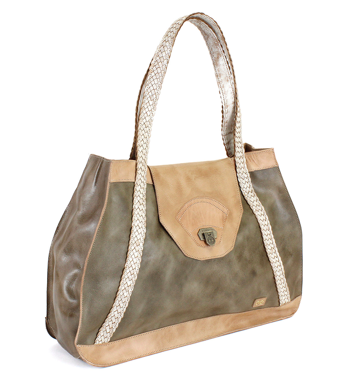 Introducing the Proper everyday tote by Bed|Stü, crafted from premium vegetable-tanned olive and tan leather for enduring durability and timeless style. This spacious bag features handwoven, light-hued straps, a secure flap closure, and is finished with a small metal clasp on the front.