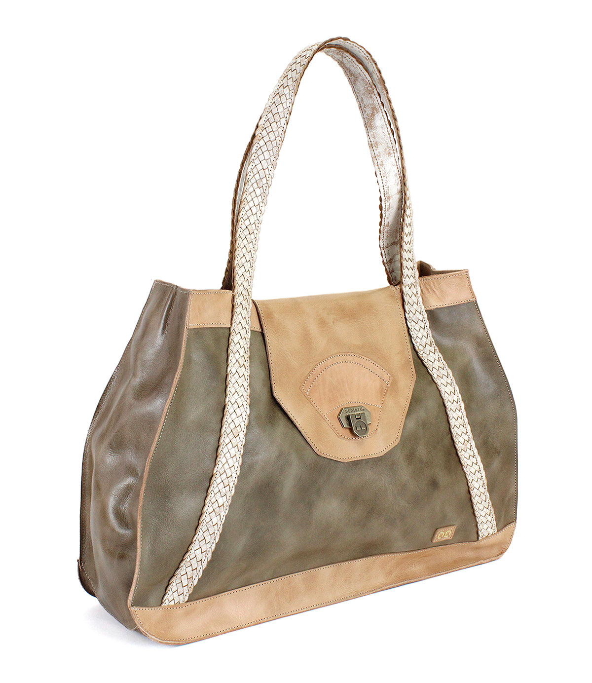 Introducing the Proper everyday tote by Bed|Stü, crafted from premium vegetable-tanned olive and tan leather for enduring durability and timeless style. This spacious bag features handwoven, light-hued straps, a secure flap closure, and is finished with a small metal clasp on the front.