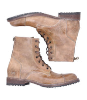 The Protege by Bed|Stü is a pair of tan leather lace-up combat boots featuring side zippers, low stacked heels, and a lightly worn texture. Displayed side by side against a white background, these durable boots offer classic styling and rugged details for everyday wear.