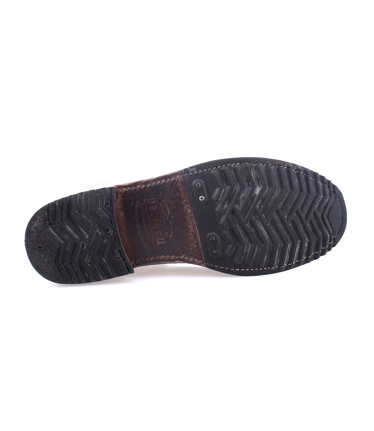 The image shows the bottom view of the Bed|Stü Protege boot in black, featuring a herringbone tread pattern on the sole and visible Goodyear welt stitching around the edge.