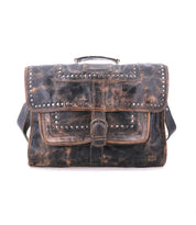 Bed|Stü “Pub” distressed leather satchel featuring metal studs, a buckle closure, top handle, and shoulder strap, displayed against a plain white background—a stylish travel bag that also serves perfectly as a unique leather briefcase.