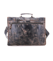 The Bed|Stü Pub is a distressed brown leather briefcase featuring a top handle, front zipper pocket, and adjustable shoulder strap—an ideal travel bag for work or on-the-go organization, pictured against a white background.