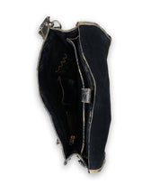 A close-up top view of the open Bed|Stü Pub handbag in black with gold trim showcases its organized interior compartments and pockets—making it the ideal choice for anyone looking for a stylish travel companion or a chic work bag to keep daily essentials neatly arranged.