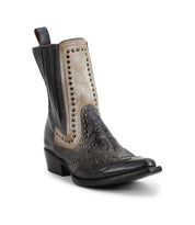 The Bed|Stü Raise boot, a single black and beige leather Western short boot featuring decorative stitching, a snip toe, and studded accents, is displayed at an angle on a white background.