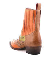 The Bed|Stü Raise is a brown and orange leather Western short boot with perforated details, stacked heel, pull tabs, and a classic snip toe design, shown from the back angle on a white background.
