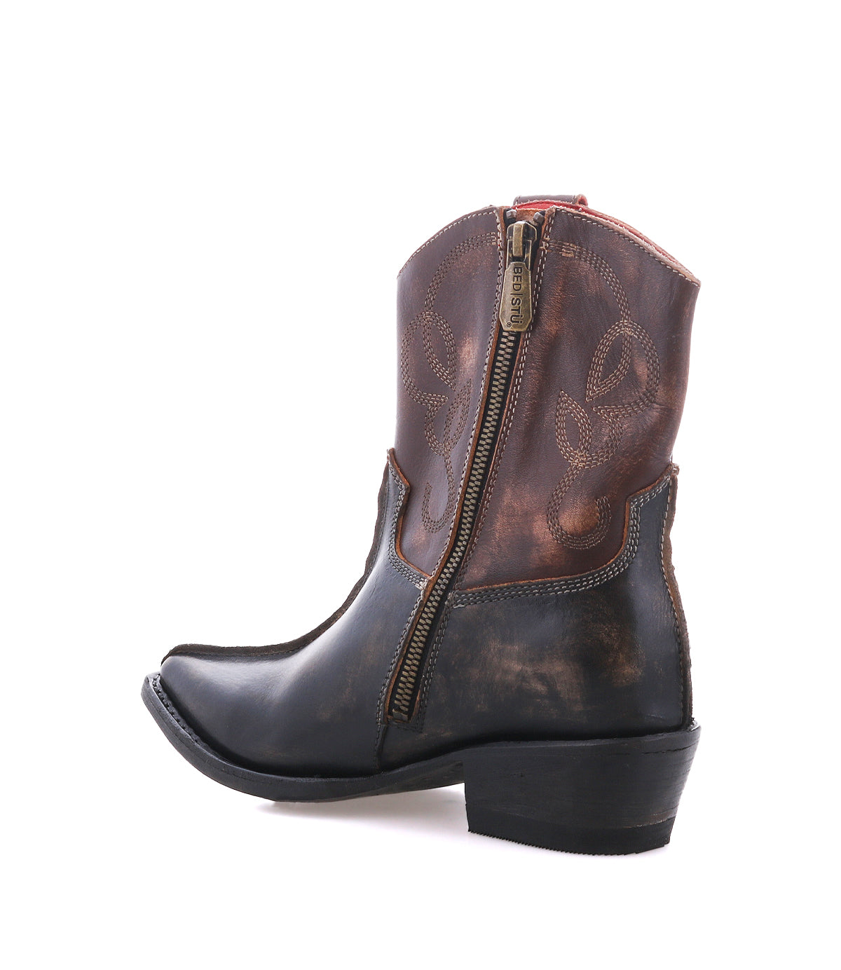 A single Bed|Stü Rangeley Western-style ankle boot, featuring a brown and black distressed finish, distinctive design details, decorative stitching, a side zipper, and a low heel, is photographed on a plain white background.