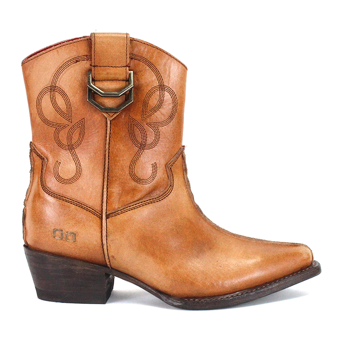 The Bed|Stü Rangeley is a tan leather cowboy boot with decorative stitching and distinctive design elements, featuring a side pull strap, pointed toe, and a short stacked heel. Displayed in side profile against a white background.