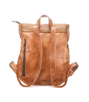 The Bed|Stü Ranger backpack is crafted from sturdy brown leather and shown from the back, featuring adjustable straps, a top handle, and a vertical zippered pocket on one side—perfect for everyday wear.