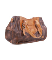 Bed|Stü Redrock brown leather handbag with a distressed finish, showcasing a heritage-inspired design, two buckled straps, and a small front logo patch, photographed on a white background.
