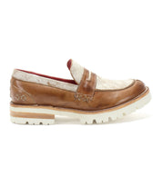 The Bed|Stü Reina III is a brown and gold, hand-finished leather penny loafer featuring a thick white treaded sole, visible stitching, and a contrasting red interior lining, shown here in profile.