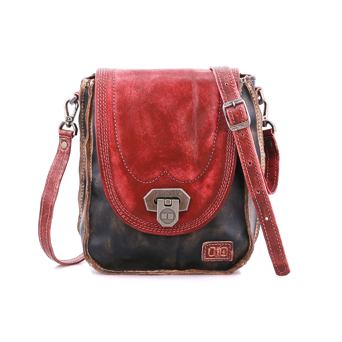 Introducing the Rhyme by Bed|Stü—a small, vintage-style leather crossbody bag featuring a striking red flap, classic black body, metal clasp, and adjustable strap. Shown against a white background, this bag offers hands-free convenience while bringing a retro touch of charm to any outfit.