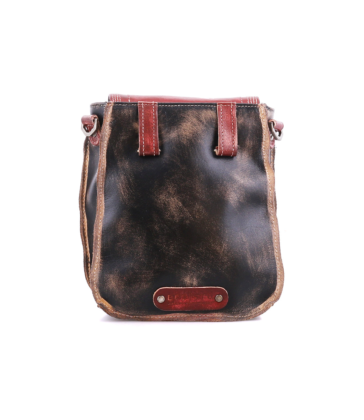 The Bed|Stü Rhyme is a small, rectangular crossbody bag crafted from distressed black leather with visible brown edges, red accents, and a metal nameplate near the bottom front, offering a stylish hands-free way to carry your essentials.